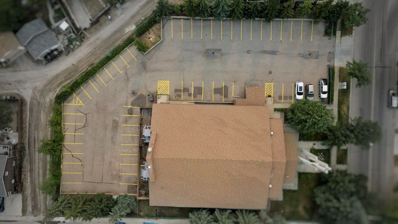 Aerial view of parking lot line striping at Croatian Catholic Parish in Calgary